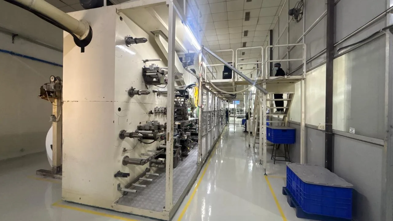Adult diaper converting machine at a manufacturing partner facility in India