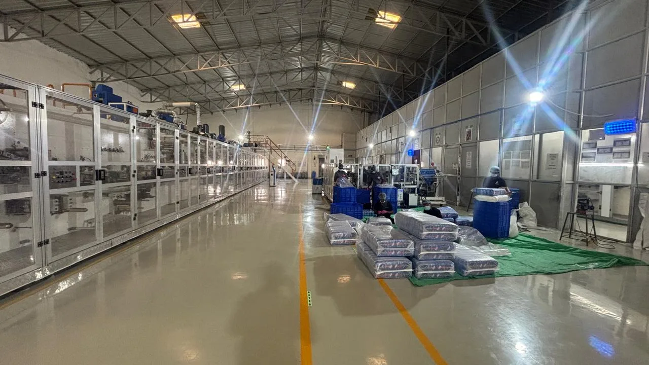 Adult diaper production line with finished, packed goods at a facility in India