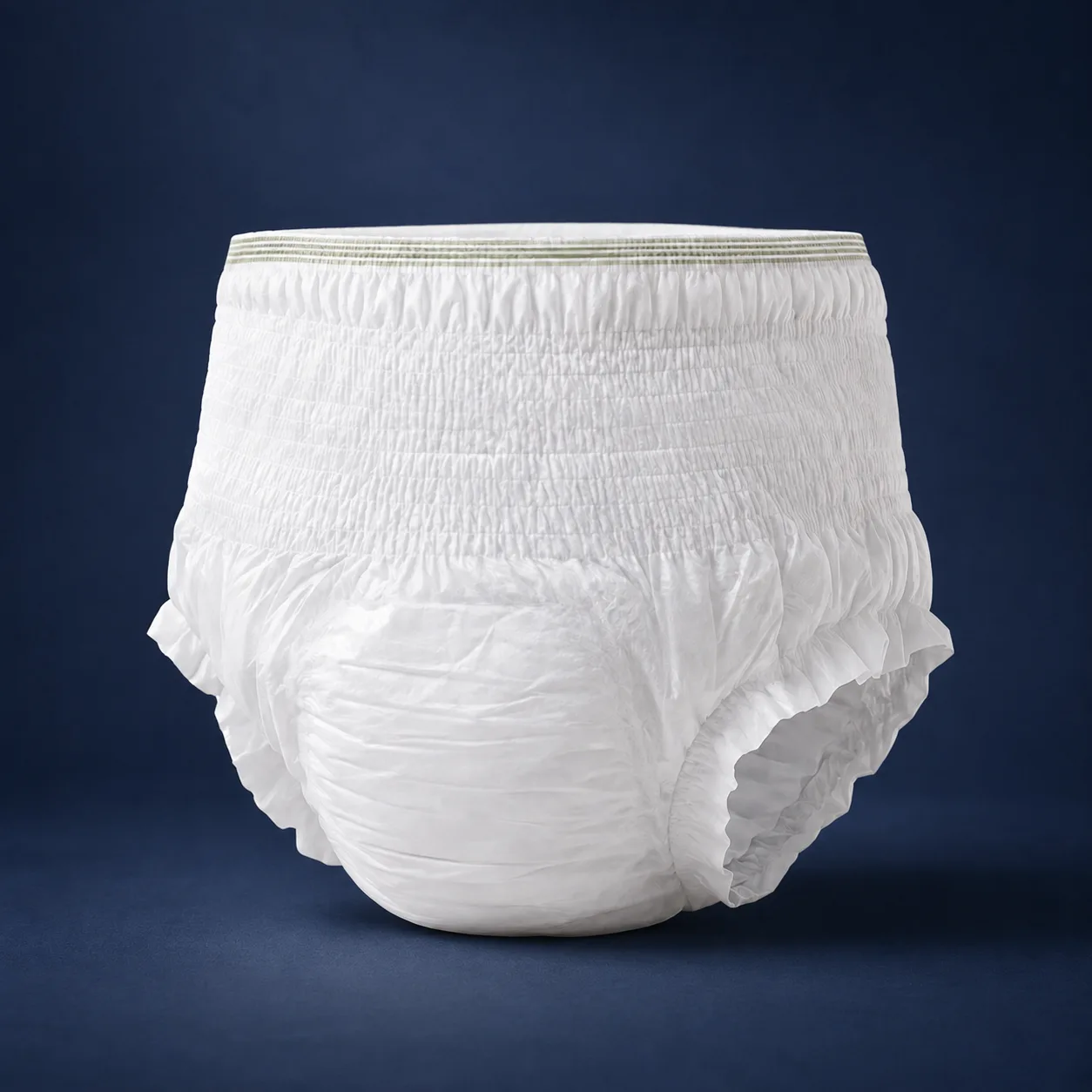 Adult diaper pants shown front-on against a navy background, with a 360 degree elastic waistband